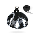 Black reflective no-pull dog harness with matching leash